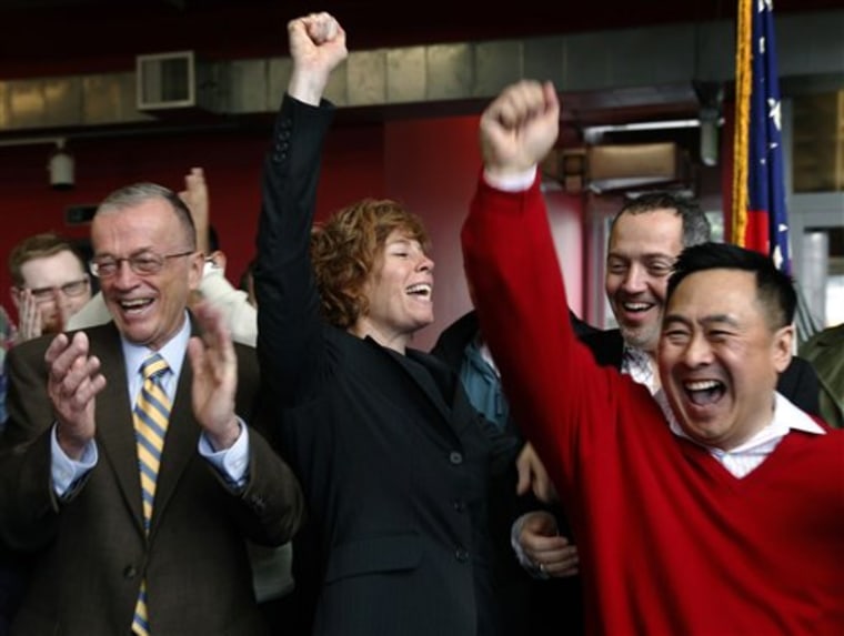 Retired Navy commander Zoe Dunning, center, celebrates the vote by the U.S. Senate at the LGBT Center in San Francisco, Calif., on Saturday. The Senate agreed on Saturday to do away with the military's 17-year ban on openly gay troops and sent President Barack Obama legislation to overturn the Clinton-era policy known as "don't ask, don't tell." For Dunning, the vote ended a long struggle that included two military discharge hearings after she declared she was gay.